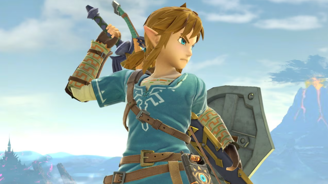 Masahiro Sakurai aide un cosplayer de Zelda à dégainer l'épée de Link en expliquant son fonctionnement dans Smash Bros.